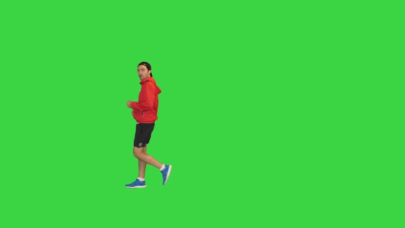 Sporty Man Doing Power Walking on a Green Screen Chroma Key