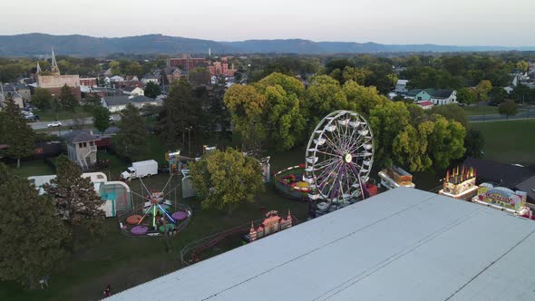 View of carnival in La Crosse, Wisconsin. River seen to edge with rocks on shoreline.