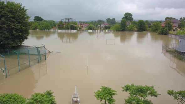 Flooded Soccer Field During a Severe Flood. Aerial Video. From the Water You Can See Only the Top of