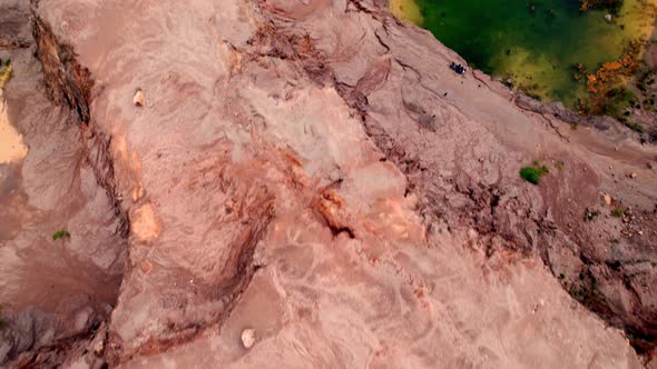 4K Aerial view of rock fissures eroded by water. alt