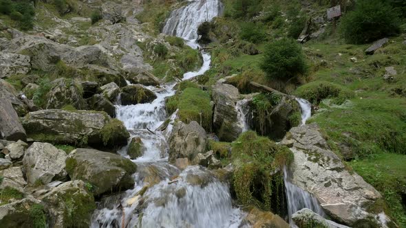 Mountain rocks and a waterfall alt