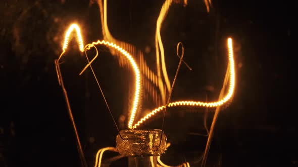 The Tungsten Filament in Classic Incandescent Glass Lamp Heats Up and Cools Down alt