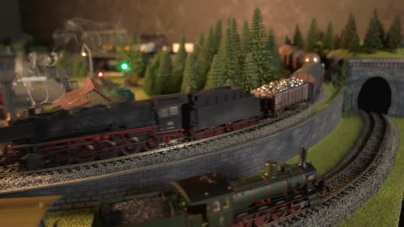 Steam Locomotives Running on Model Railroad. alt