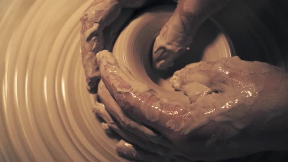 Woman's Hands Create Ceramic Pot