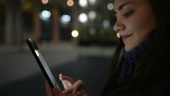 Young business woman outdoor using tablet hand hold looking touchscreen alt