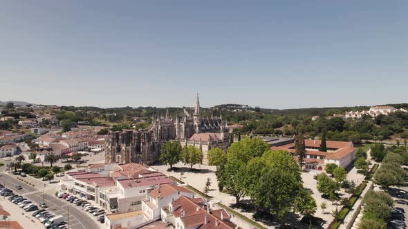 Monastery of Batalha, Leiria, Portugal. Gothic Dominican convent. Aerial forward alt