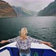 A Woman Stands on the Bow of a Cruise Ship - VideoHive Item for Sale
