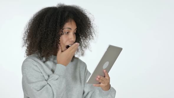 African Woman Celebrating on Tablet White Background alt