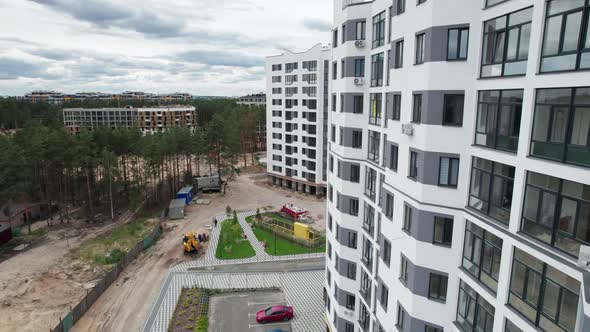 Aerial View of a Newly Modern MultiStorey Building in a Forest Area alt