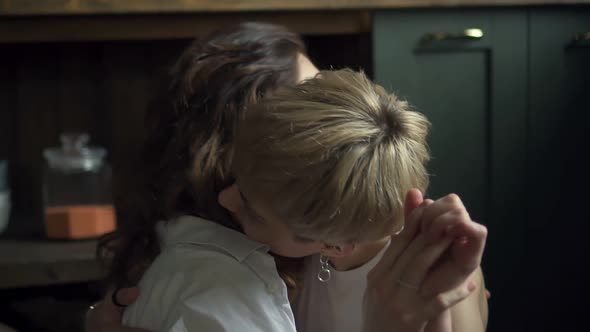 Portrait of Young Lesbian Young Womans are Showing Love and Sensuality Sitting in Interior alt