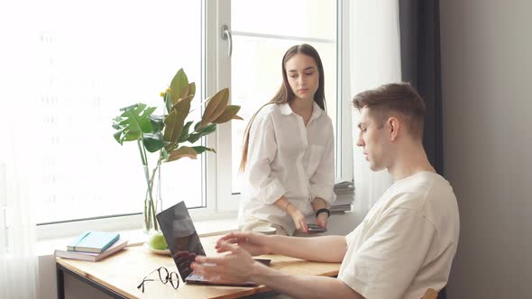 Man Work at Home, He Is in Freelance During Quarantine Coronavirus, He Use Laptop. alt