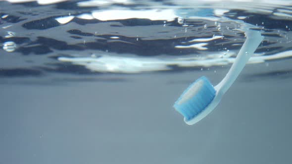 Teeth Brush Immerse in Clear Water