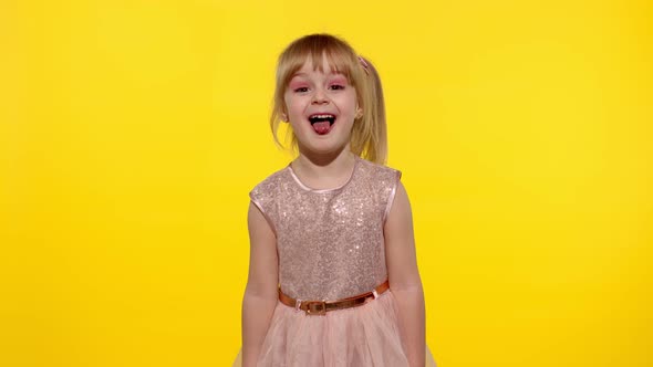 Child Making Faces, Fooling Around, Showing Tongue. Little Blonde Teen Kid Girl 5-6 Years Old Posing alt