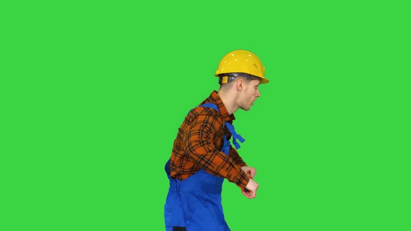 Funky Dancing By Young Construction Worker in Safety Hat on a Green Screen, Chroma Key alt