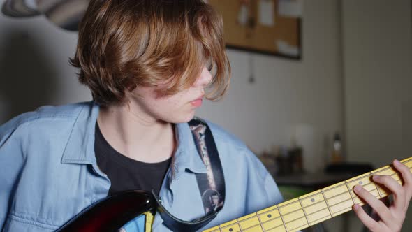 Young Girl Is Playing Bass Guitar 3