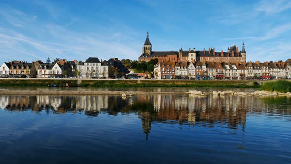 Gien, Loiret, France. The castle and the church overlooking the Loire river. alt