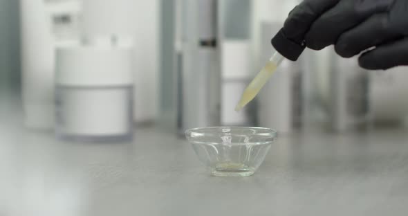 Cosmetology Hyaluronic Acid Is Poured Into A Vessel  alt
