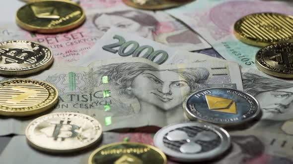 Throwing Bitcoin between cryptocurrency coins on Czech banknotes. alt