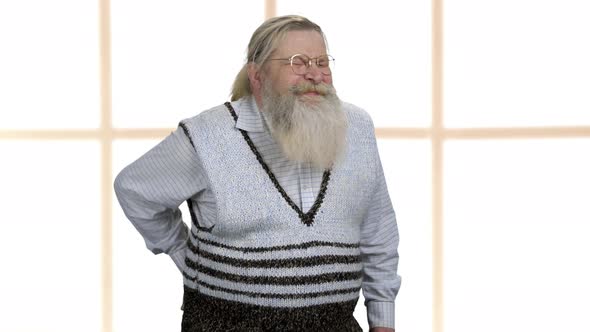 Unhappy Senior Man Suffering From Lower Back Ache alt