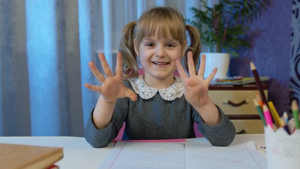 Child Girl Doing Homework Teach Mathematic and Counting with Teacher at Home Video Call By Webcam alt