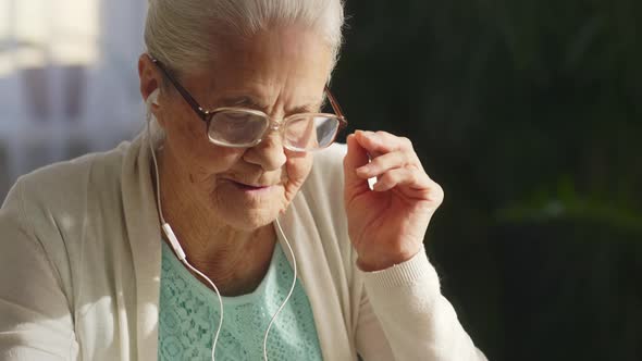 Senior Woman Watching Video on Digital Tablet