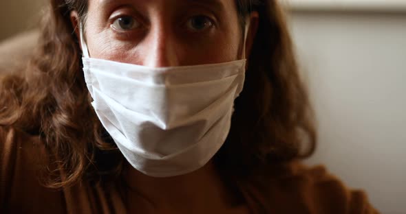 Rear view of a Caucasian and a mixed race girl riding and skateboarding alt