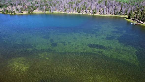 Drone slowly moving across Lyman Lake in Utah alt