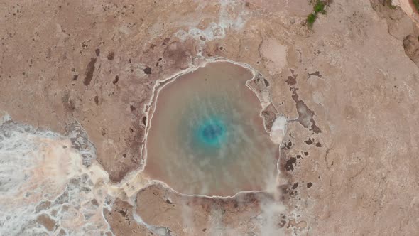 Aerial Birds Eye Overhead Top Down Descending Footage of Geysir Lagoon with Hot Water alt