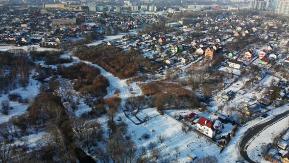 Flight over the suburbs. Winter cityscape. Aerial photography. alt