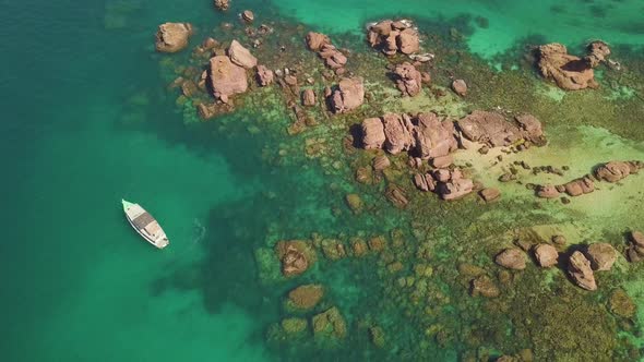 Top Aerial View of Rocky Islands with Coral Reefs and Turquoise Blue Clear Water alt