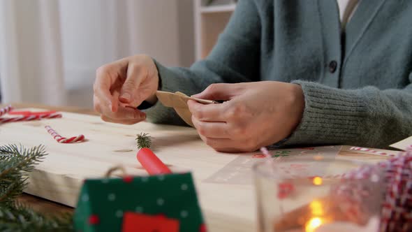 Hands Making Advent Calender on Christmas at Home alt