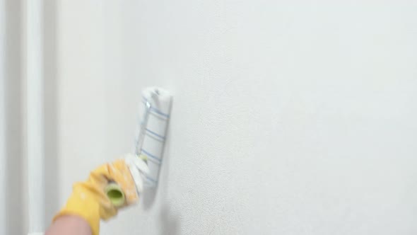 Closeup of a Female Hand in Yellow Construction Gloves alt