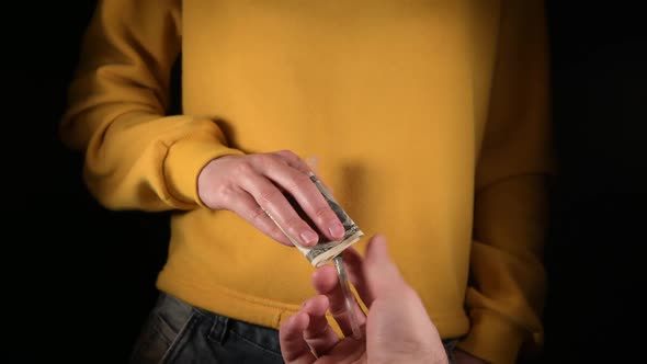 Scene of a syringe with drug purchase, close-up, without faces alt