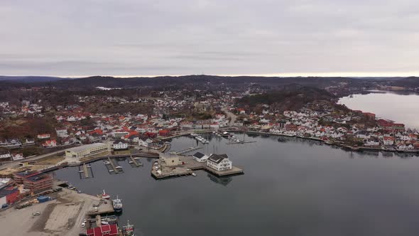 Beautiful Grimstad city and coastal Marina during early morning with reflections in sea - High altit alt