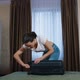 Young woman is packing bag in a hotel room. Time to go home. Vocation time concept. - VideoHive Item for Sale