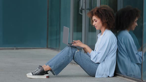 Focused Young African American Business Woman Student Girl Female Freelancer User Sitting on Floor alt