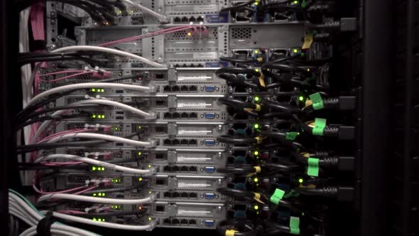 back side of working data servers with flashing LED lights hd