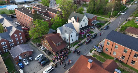 Fraternity sorority Greek life at college party. Students partying, drinking at frat house. Exterior alt