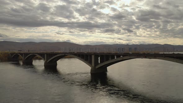 Aerial View of Cars Driving Over the Bridge in the City alt