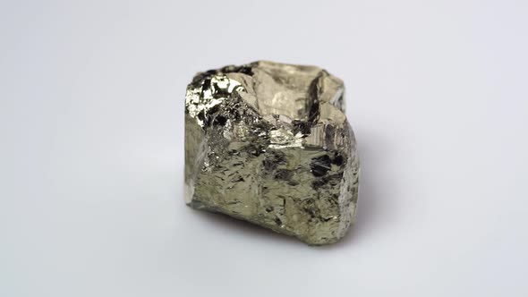 Natural Silver Pyrite Gemstone on the White Turning Table