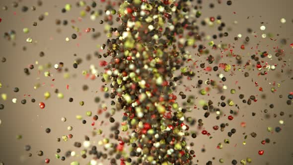 Super Slow Motion Shot of Pepper Seasoning Side Collision on Brown Background at 1000Fps. alt
