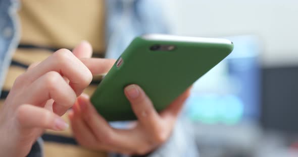 Woman working on smart phone alt