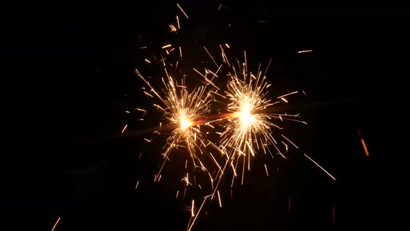 Handheld sparkle isolated on black. New year concept