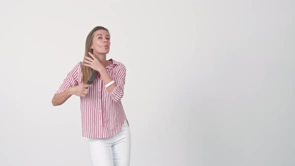 Woman Dancing and Brushing Hair