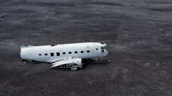 Aerial of an Abandoned Crashed Plane Wreckage on Solheimasandur Beach Iceland alt