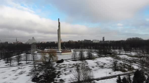 Aerial view of Victory Park and Memorial to Soviet Army on snowy winter day in Riga, Latvia alt