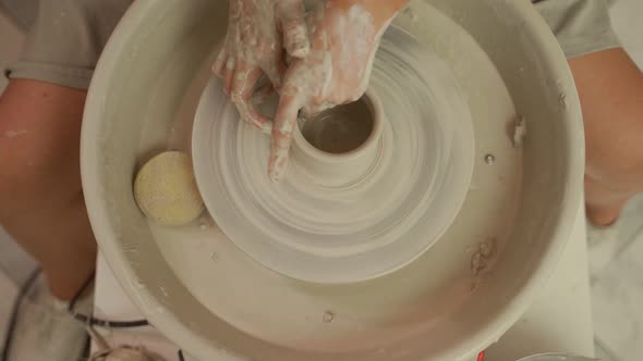 Artisan Making Clayware on Pottery Wheel