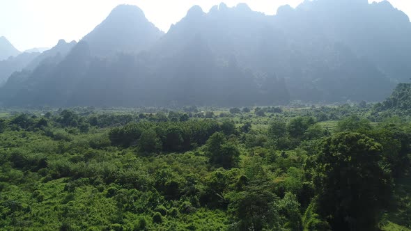 Nature landscape near town of Vang Vieng in Laos seen from the sky alt