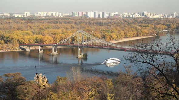 Autumn Dnieper in Kiev on a Sunny Day. View of the Park Bridge