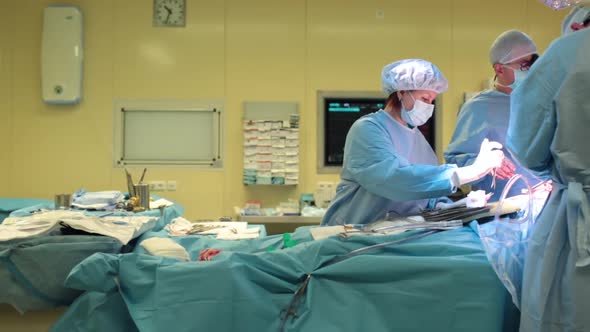 Assistant Helps the Surgeon During the Operation